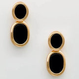 Brinco Preto Contorno Dourado